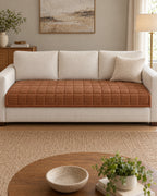 Chestnut Haze: Metro Line Quilted Couch Cover Mat shown on a full sofa, arms uncovered