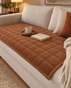 Chestnut Haze: Metro Line Quilted Couch Cover Mat on a cozy lived-in sofa