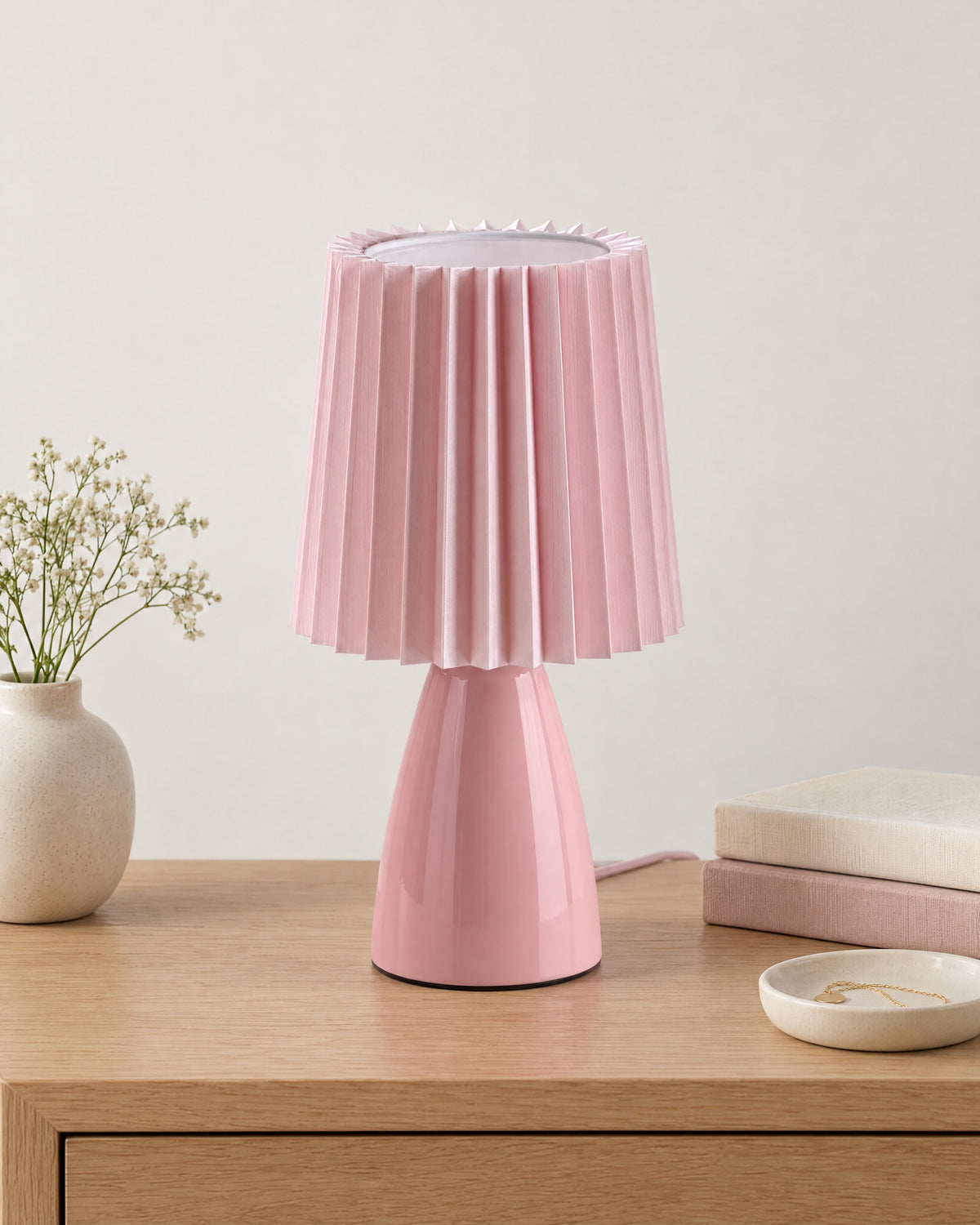 Pink: Milkshake Ceramic Cone Nightstand Lamp on a nightstand top against a light studio backdrop