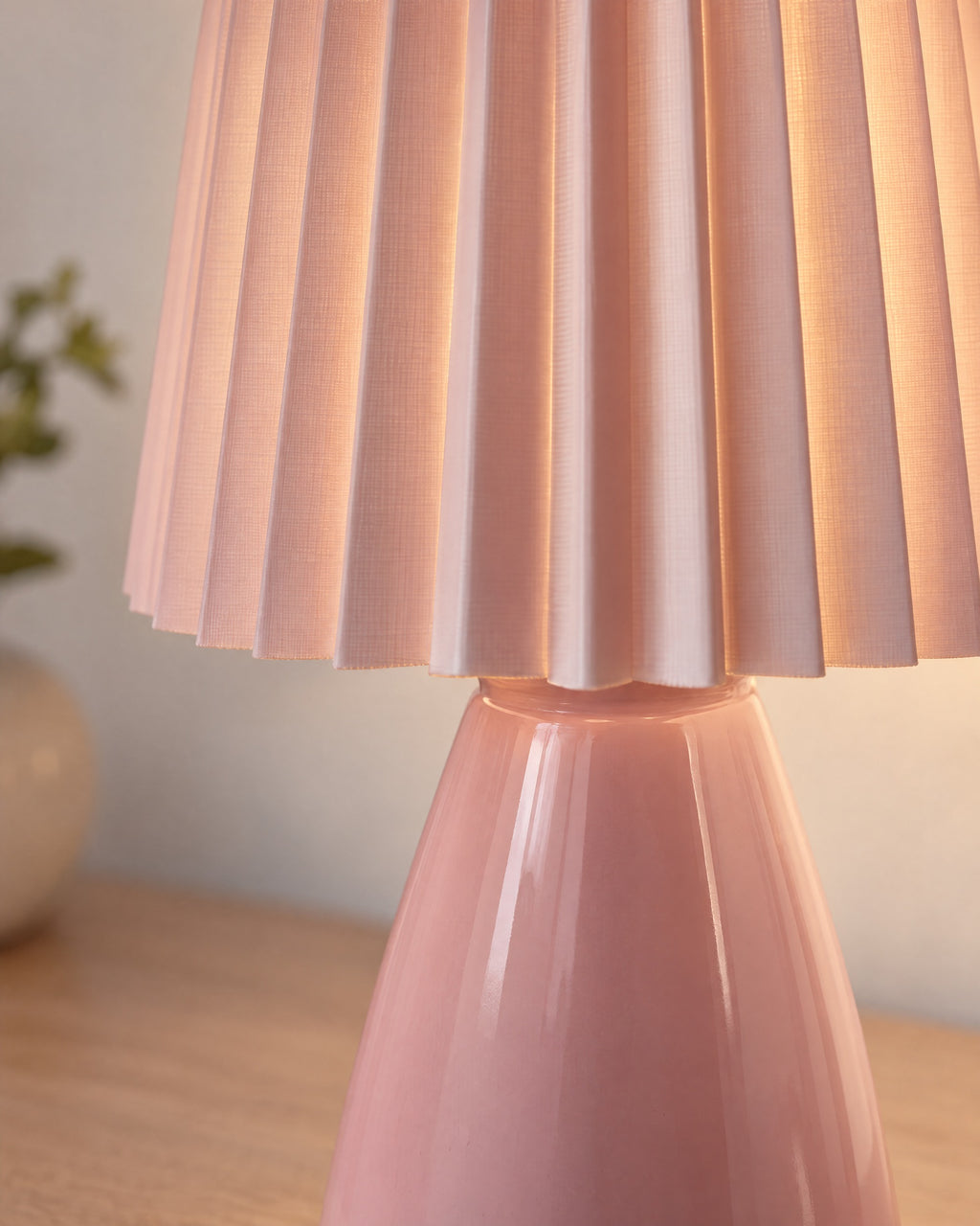 Pink: Close-up of the pleats and glazed finish of the Milkshake Ceramic Cone Nightstand Lamp