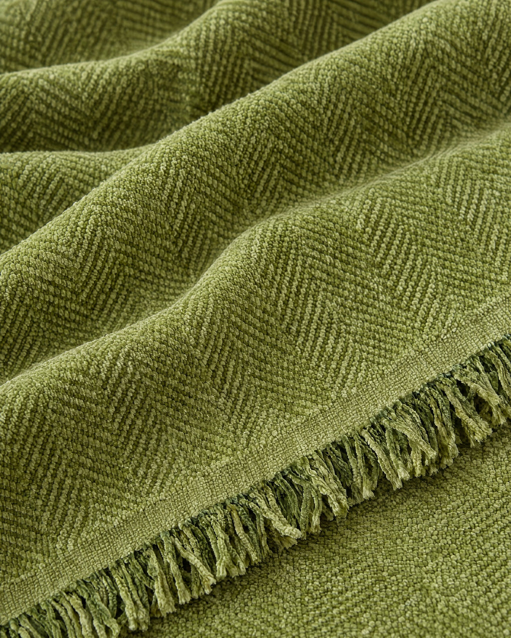 Green: Close-up of the fabric of the Minimalist Sofa Cover