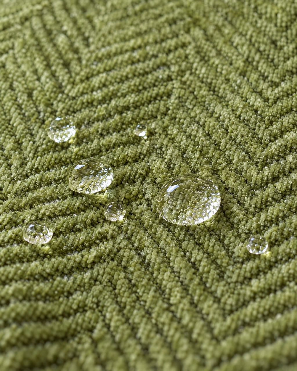 Green: Water droplets beading on the fabric of the Minimalist Sofa Cover
