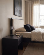 Black: Black cordless dome nightstand lamp on a dark bedside table in a quiet bedroom