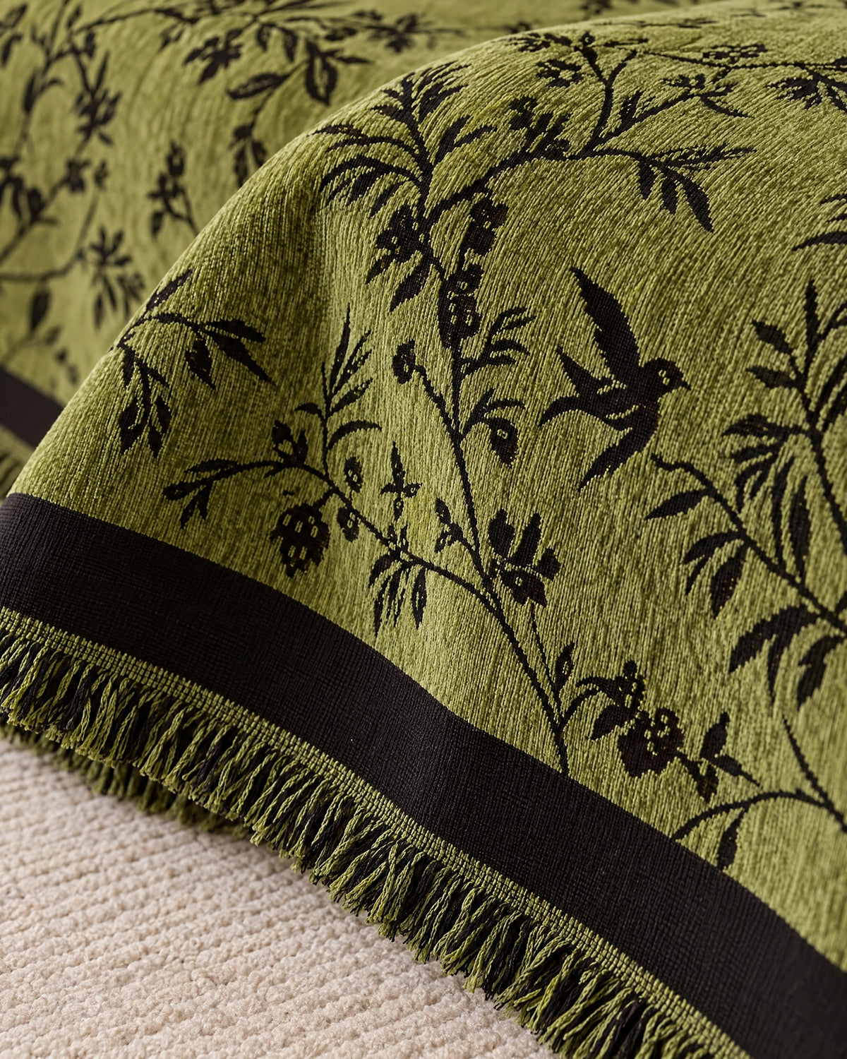 Olive Green: Close-up of the edge finish of the Ormel Elegant Chenille Sofa Cover