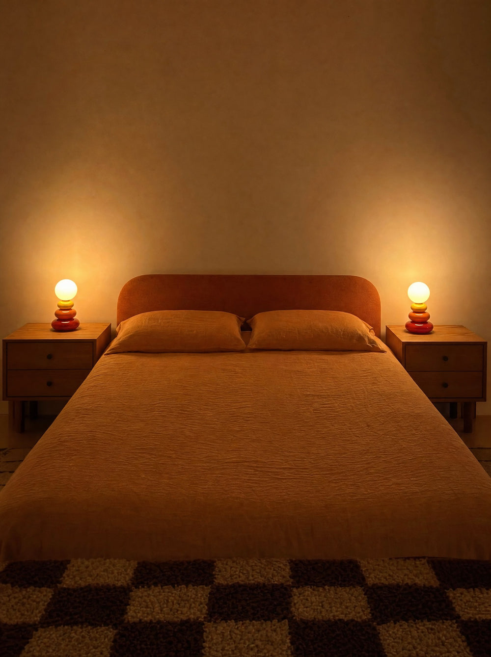 Pebble Stack Ceramic Nightstand Lamp, as a pair on both nightstands at night