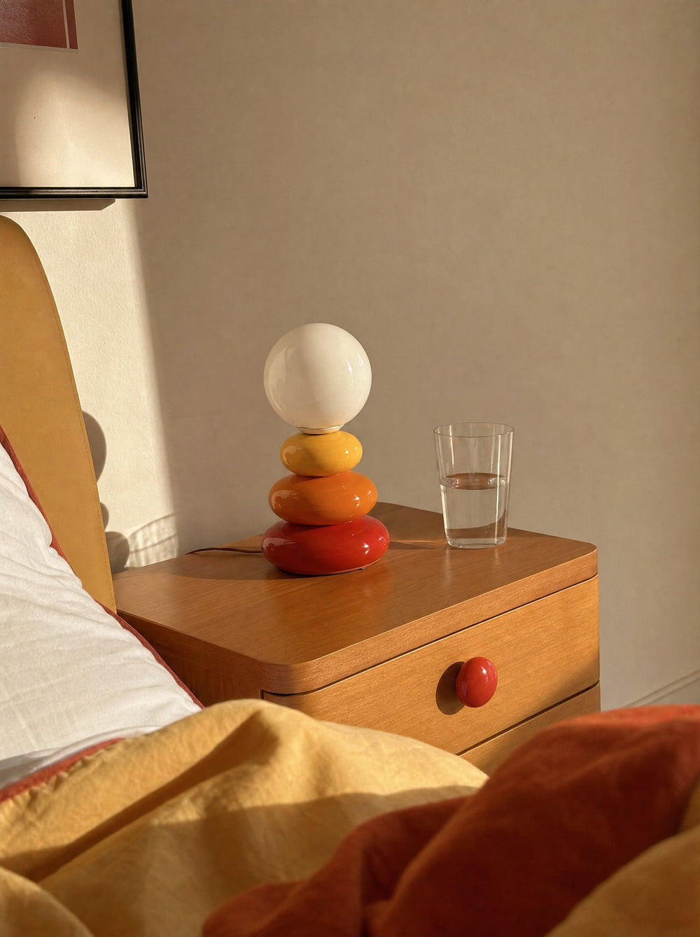 Pebble Stack Ceramic Nightstand Lamp, seen from the bed in the morning