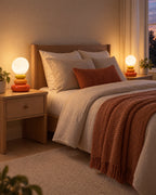 Orange: Two Pebble Stack Ceramic Nightstand Lamp lamps in orange flanking a bed