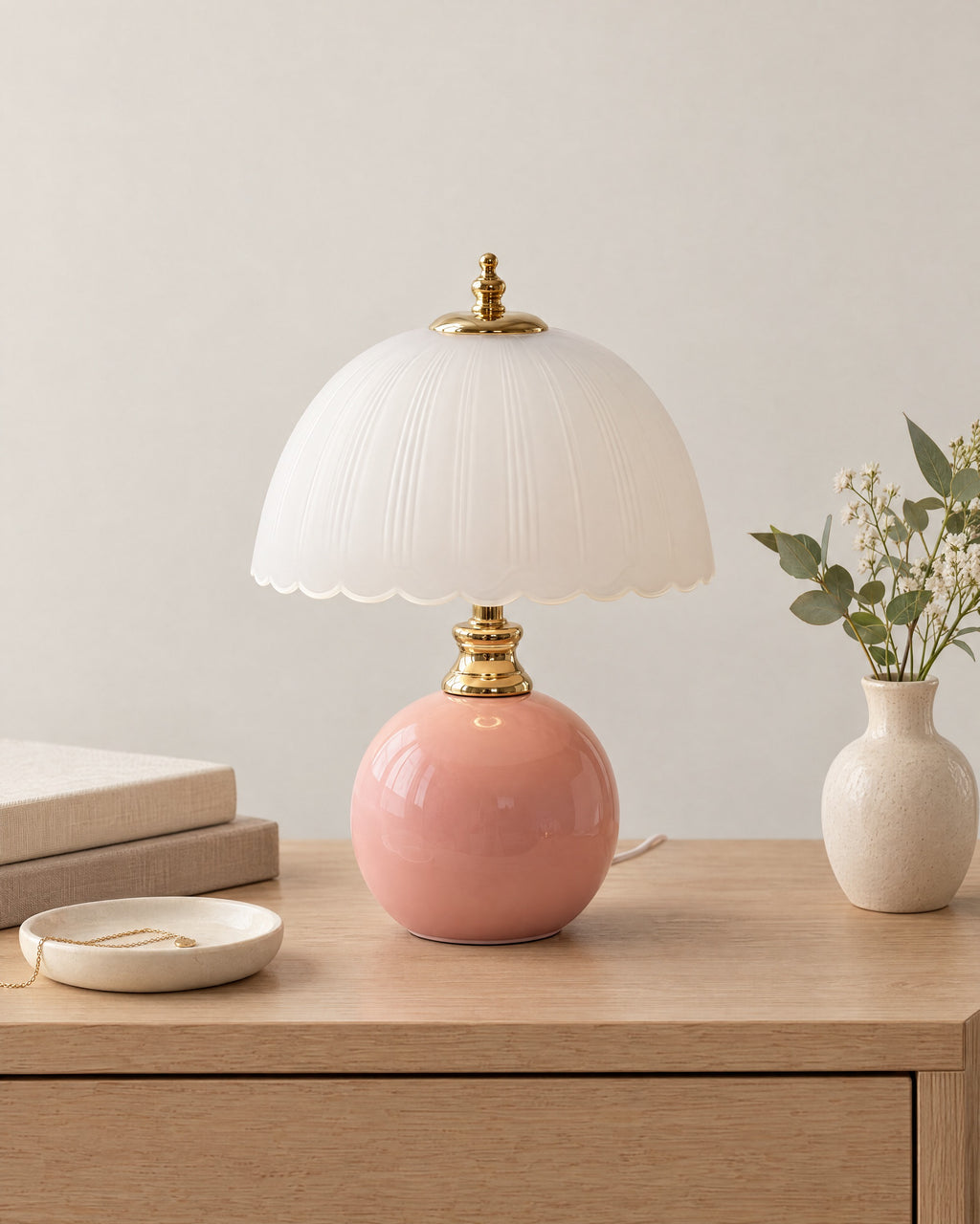 Pink: Petal Dome Ceramic Nightstand Lamp in pink on a nightstand top against a light studio backdrop