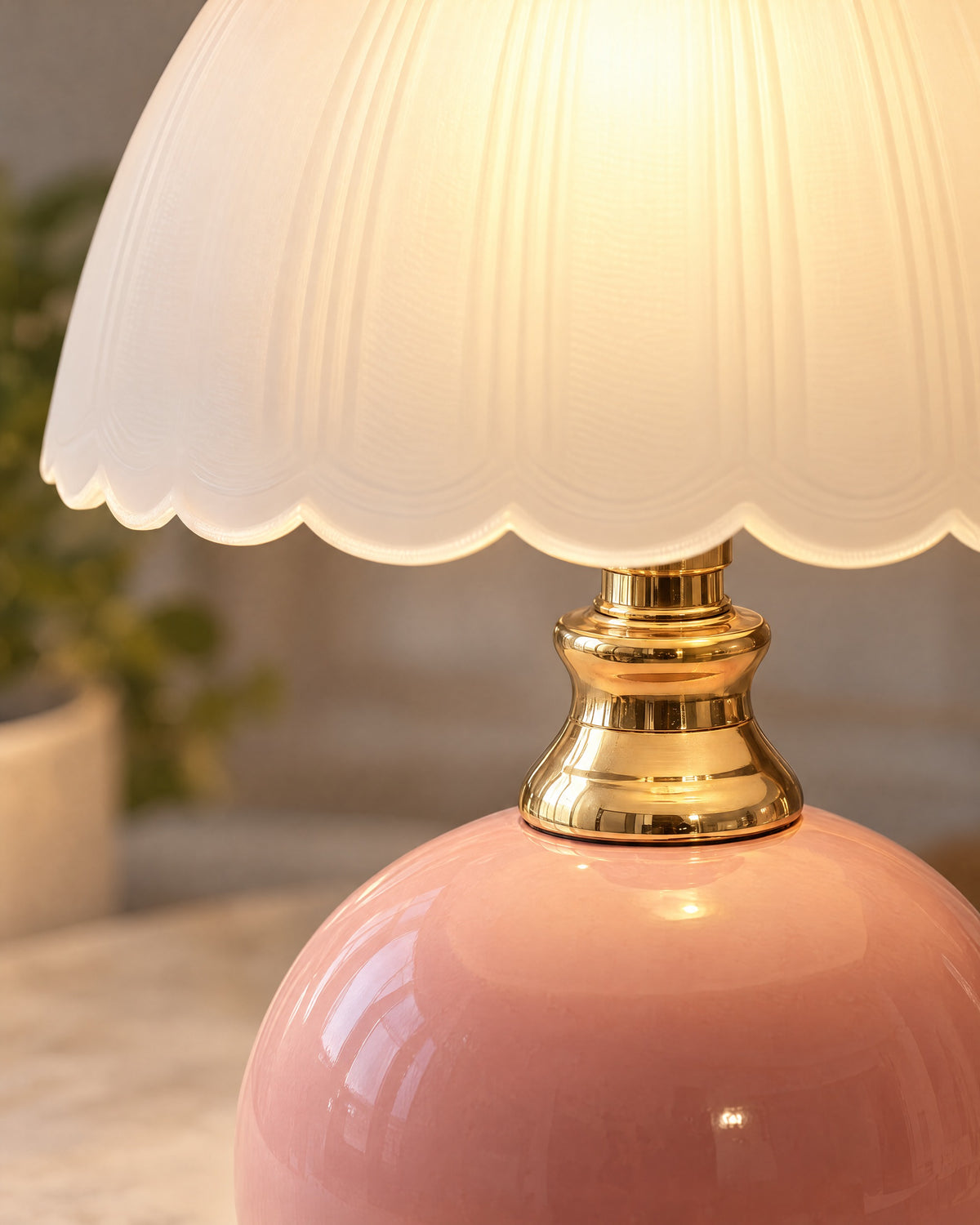 Pink: Close-up of the pink finish and hardware of the Petal Dome Ceramic Nightstand Lamp