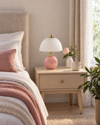 Pink: Petal Dome Ceramic Nightstand Lamp in pink switched off in soft morning daylight