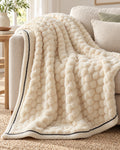 Popcorn Fleece Throw Blanket, Cream, Jacquard Texture draped over a sofa