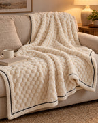 Popcorn Fleece Throw Blanket, Cream, Jacquard Texture on a sofa in warm evening light