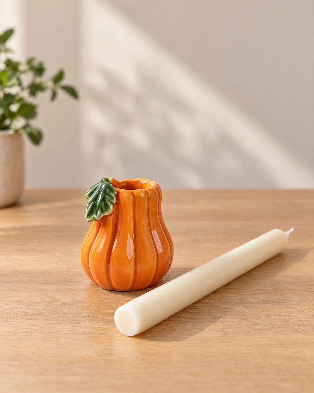 Zucca Pumpkin Ceramic Candle Holder with the candle type that fits, shown beside it