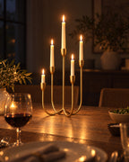 Quinta Five-Arm Iron Candelabra with candles lit at night on a dinner table
