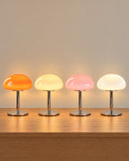 All colourways of the Retro Glass Mushroom Nightstand Lamp side by side: Orange, Cream, Pink, White