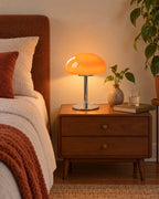 Orange: Retro Glass Mushroom Nightstand Lamp in a styled mid-century bedroom at dusk