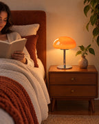 Orange: Retro Glass Mushroom Nightstand Lamp as a reading light beside a woman reading in bed