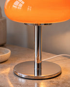 Orange: Close-up of the glass dome and polished chrome stem of the Retro Glass Mushroom Nightstand Lamp