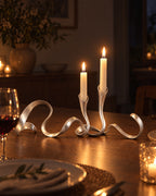Silver: Ribbon Metal Candelabra with candles lit at night on a dinner table