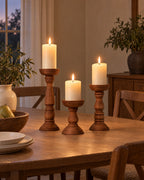 Bosco Farmhouse Wood Candle Holders, Set of 3 styled in a warm interior at dusk