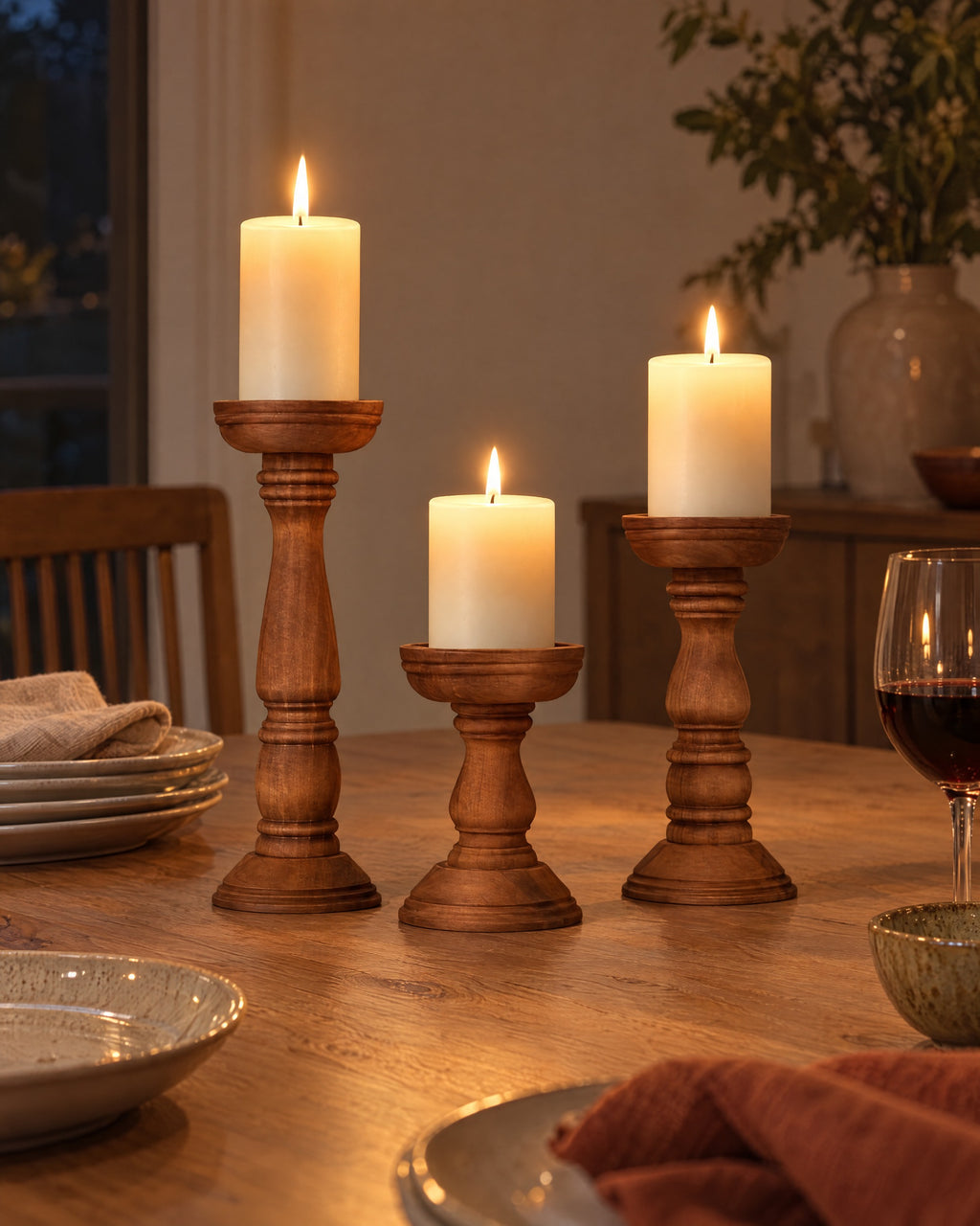Bosco Farmhouse Wood Candle Holders, Set of 3, lit, in a lived-in evening scene