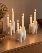 Duna Sculptural Ceramic Candle Holder, three styled together with lit candles