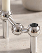 Silver: Close-up of the material and finish of the Orbit Stackable Metal Candlestick
