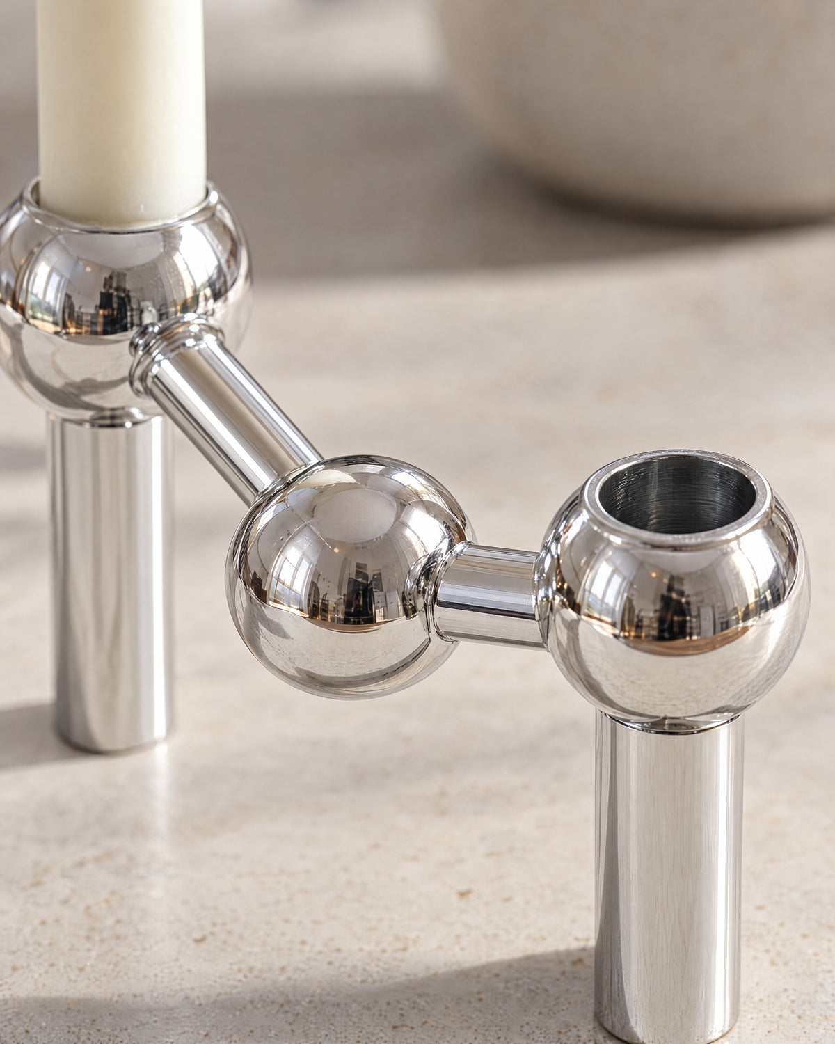 Silver: Close-up of the material and finish of the Orbit Stackable Metal Candlestick