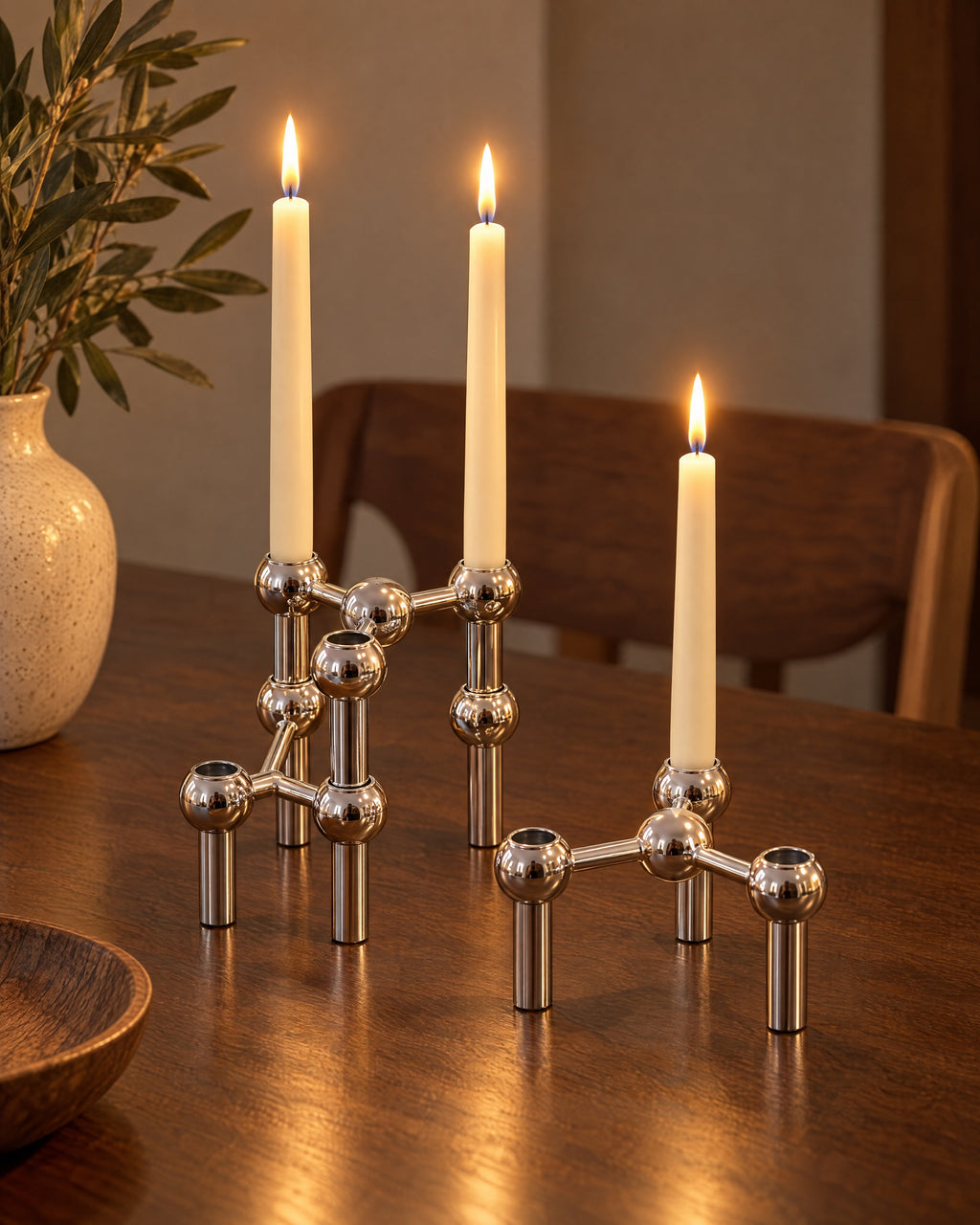 Silver: Orbit Stackable Metal Candlestick, three styled together with lit candles