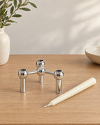 Silver: Orbit Stackable Metal Candlestick with the candle type that fits, shown beside it