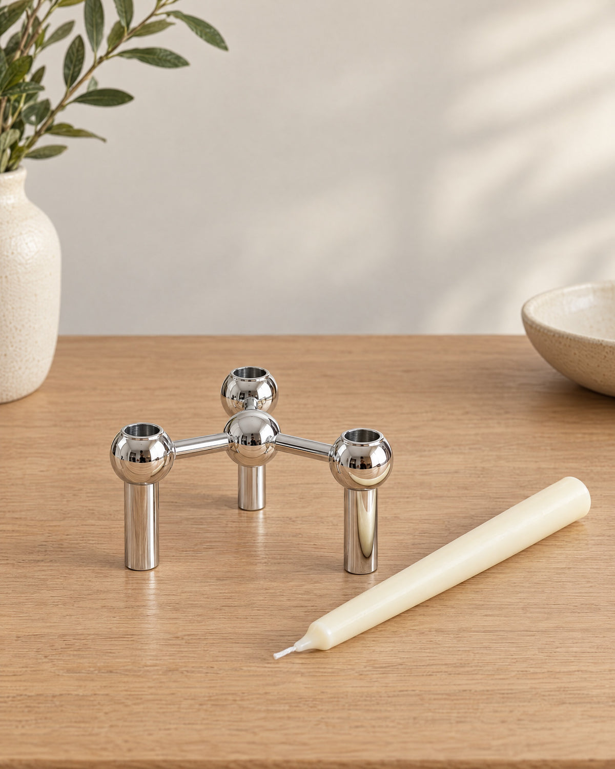Silver: Orbit Stackable Metal Candlestick with the candle type that fits, shown beside it