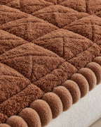 Mocha Brown: Close-up of the fabric of the Snuggle Sherpa Plush Sofa Protector Cover