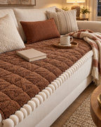 Mocha Brown: Snuggle Sherpa Plush Sofa Protector Cover on a cozy lived-in sofa