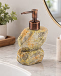 Stacked Stone Soap Dispenser, Ceramic, Bronze Pump, 10.5 oz on a bathroom vanity in soft daylight
