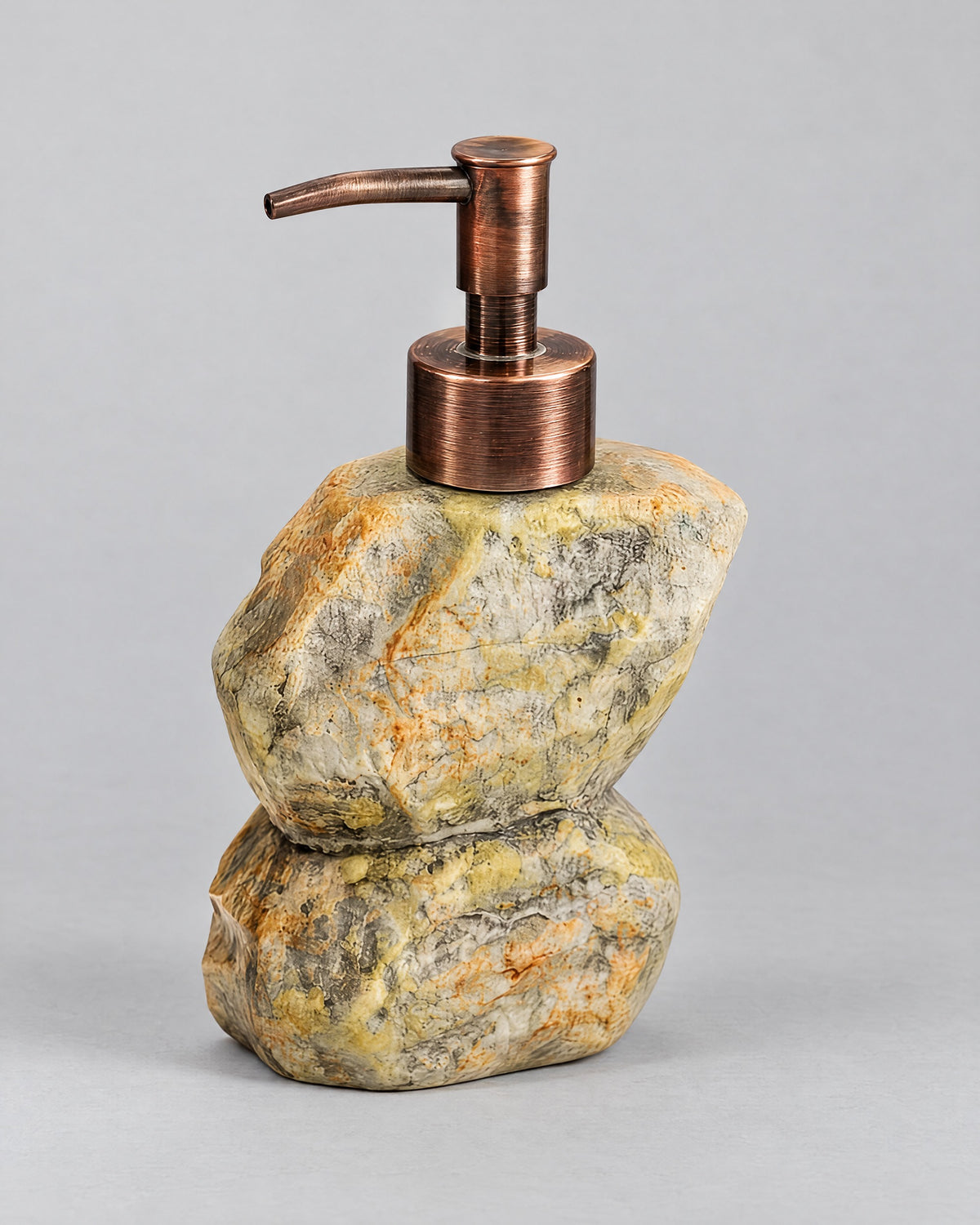 Stacked Stone Soap Dispenser, Ceramic, Bronze Pump, 10.5 oz against a seamless studio backdrop