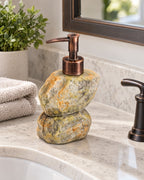 Stacked Stone Soap Dispenser, Ceramic, Bronze Pump, 10.5 oz styled on a bathroom counter