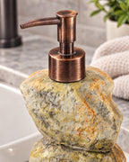 Close-up of the glaze and pump finish of the Stacked Stone Soap Dispenser, Ceramic, Bronze Pump, 10.5 oz