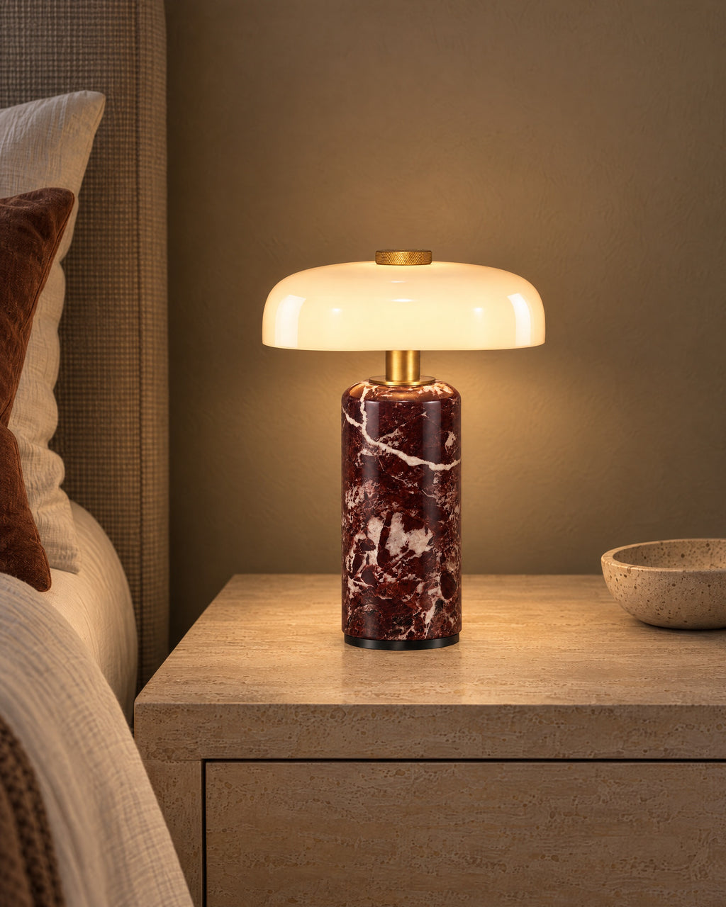 Red Marble: Stone Cordless Marble Nightstand Lamp switched on on a nightstand in the evening