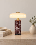 Red Marble: Stone Cordless Marble Nightstand Lamp on a nightstand top against a light studio backdrop