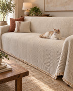 Ivory Sand: A cat resting on the Stripe Herringbone Sofa Cover
