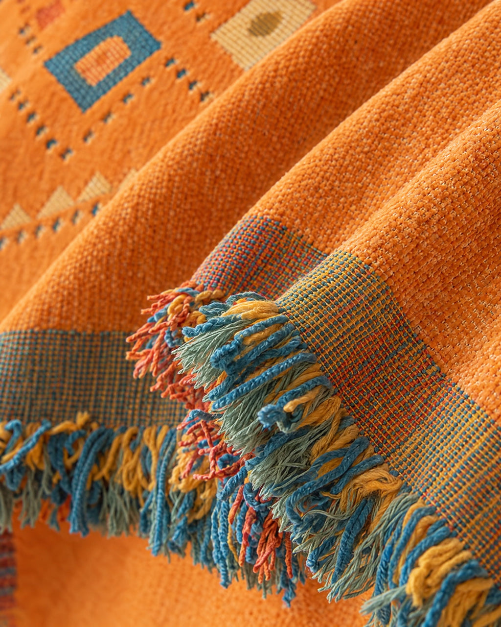 Orange: Close-up of the edge finish of the Stylish Boho Sofa Cover