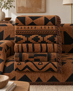 Bold Triangles: All variants of the Tribal Geometric Chenille Sofa Cover folded in one stack