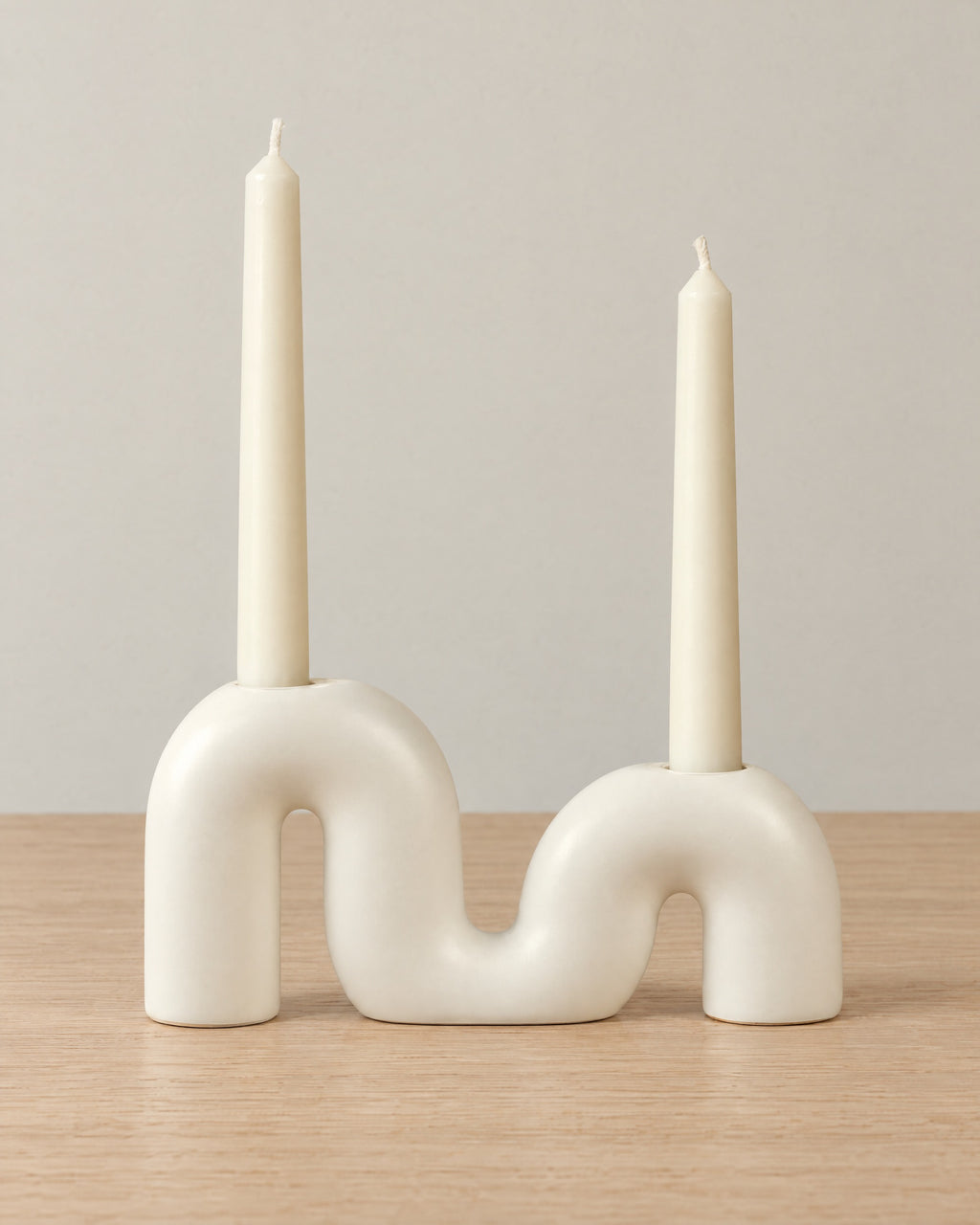 Twist Ceramic Double Candle Holder on a light oak tabletop against a seamless studio backdrop