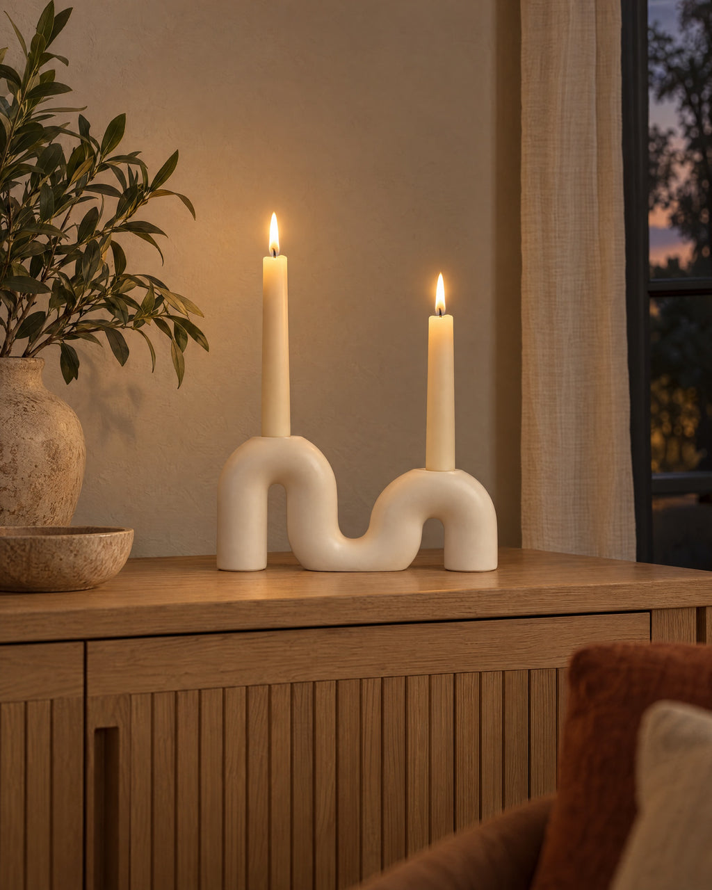 Twist Ceramic Double Candle Holder styled in a warm interior at dusk