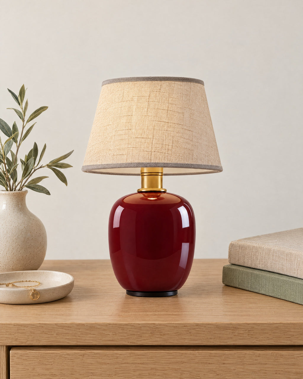 Burgundy: Vessel Cordless Ceramic Nightstand Lamp on a nightstand top against a light studio backdrop