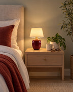 Burgundy: Vessel Cordless Ceramic Nightstand Lamp in a styled bedroom at dusk