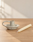 Wabi Speckled Ceramic Chamberstick with the candle type that fits, shown beside it