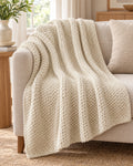 Waffle Knit Throw Blanket, Cream, All-Season draped over a sofa