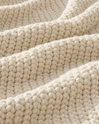 Close-up of the texture of the Waffle Knit Throw Blanket, Cream, All-Season