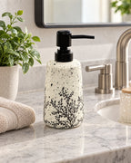 White Soap Dispenser, Speckled Ceramic, Black Pump, 11 oz styled on a bathroom counter